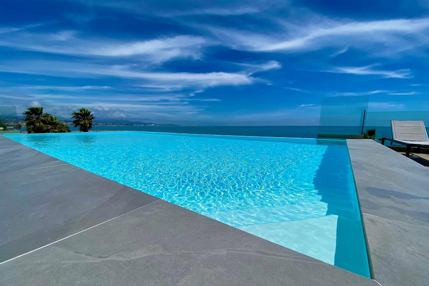 Shared pool with terrace and sea view