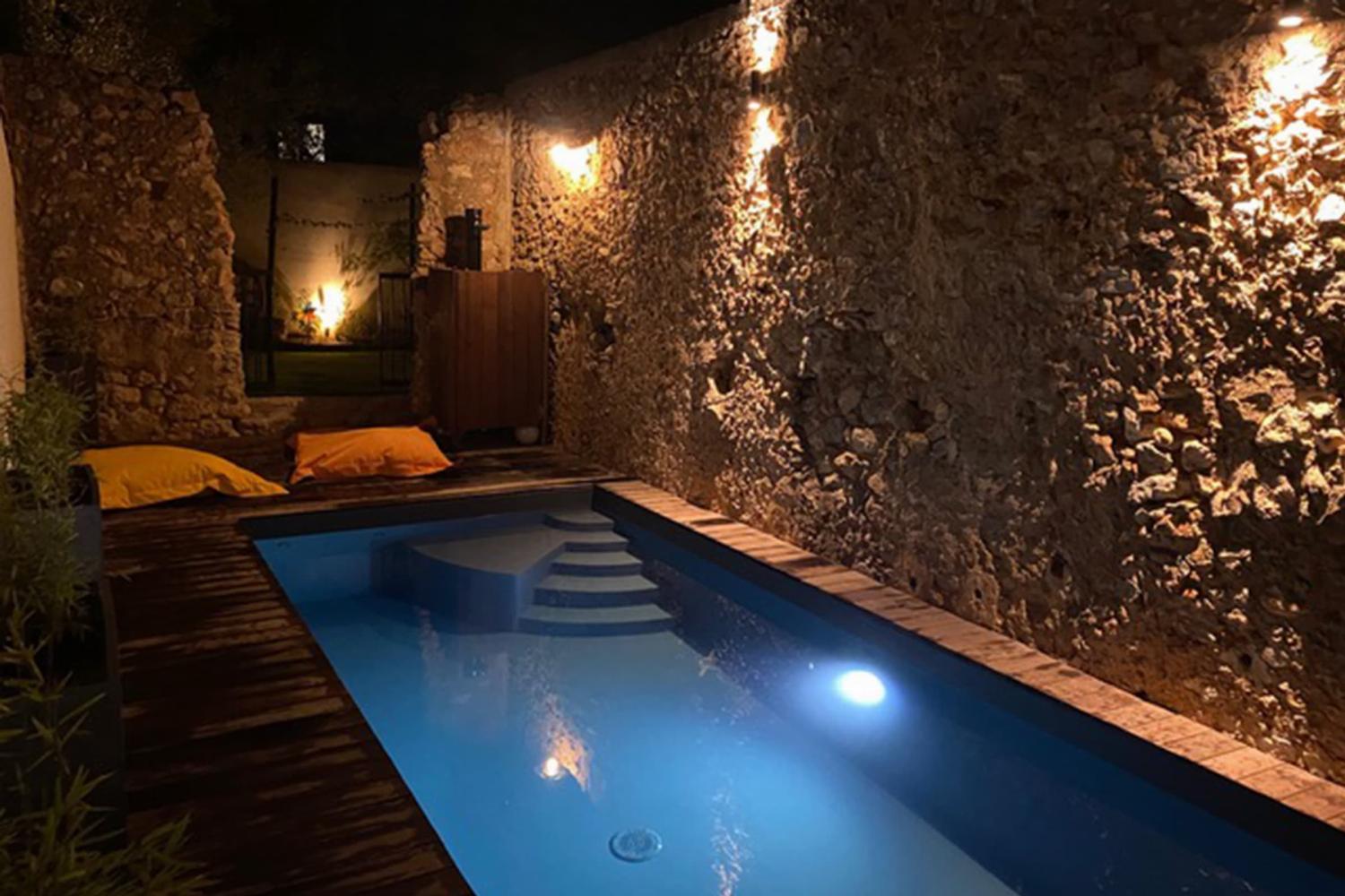 Private heated pool at night