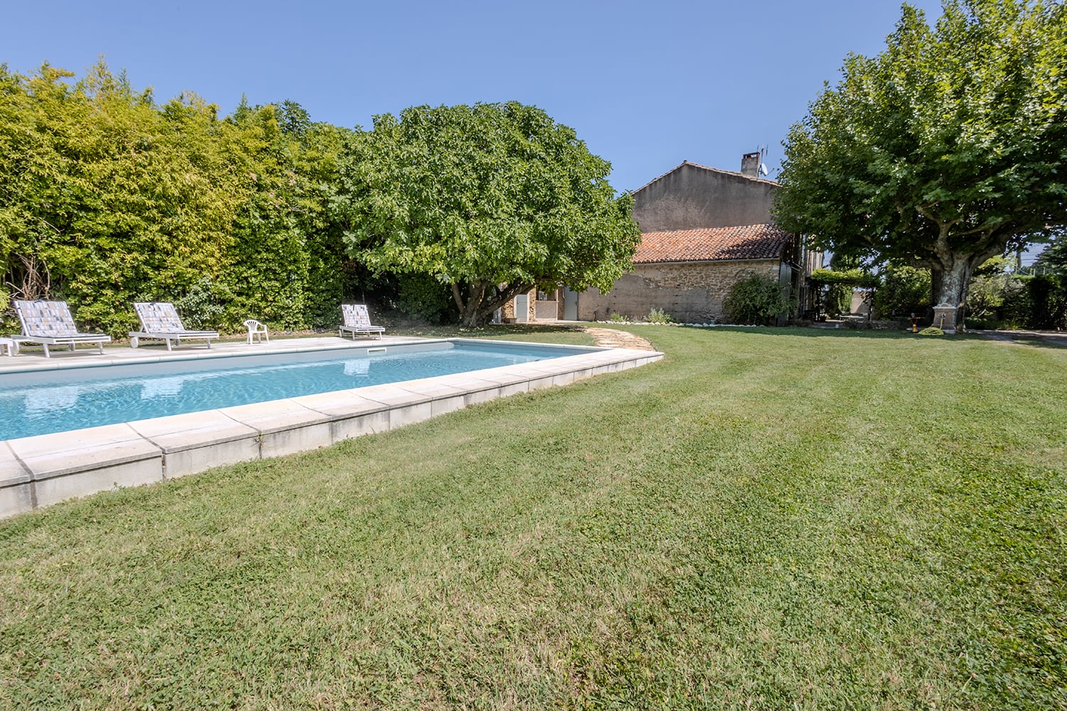 Private heated pool and lawned garden