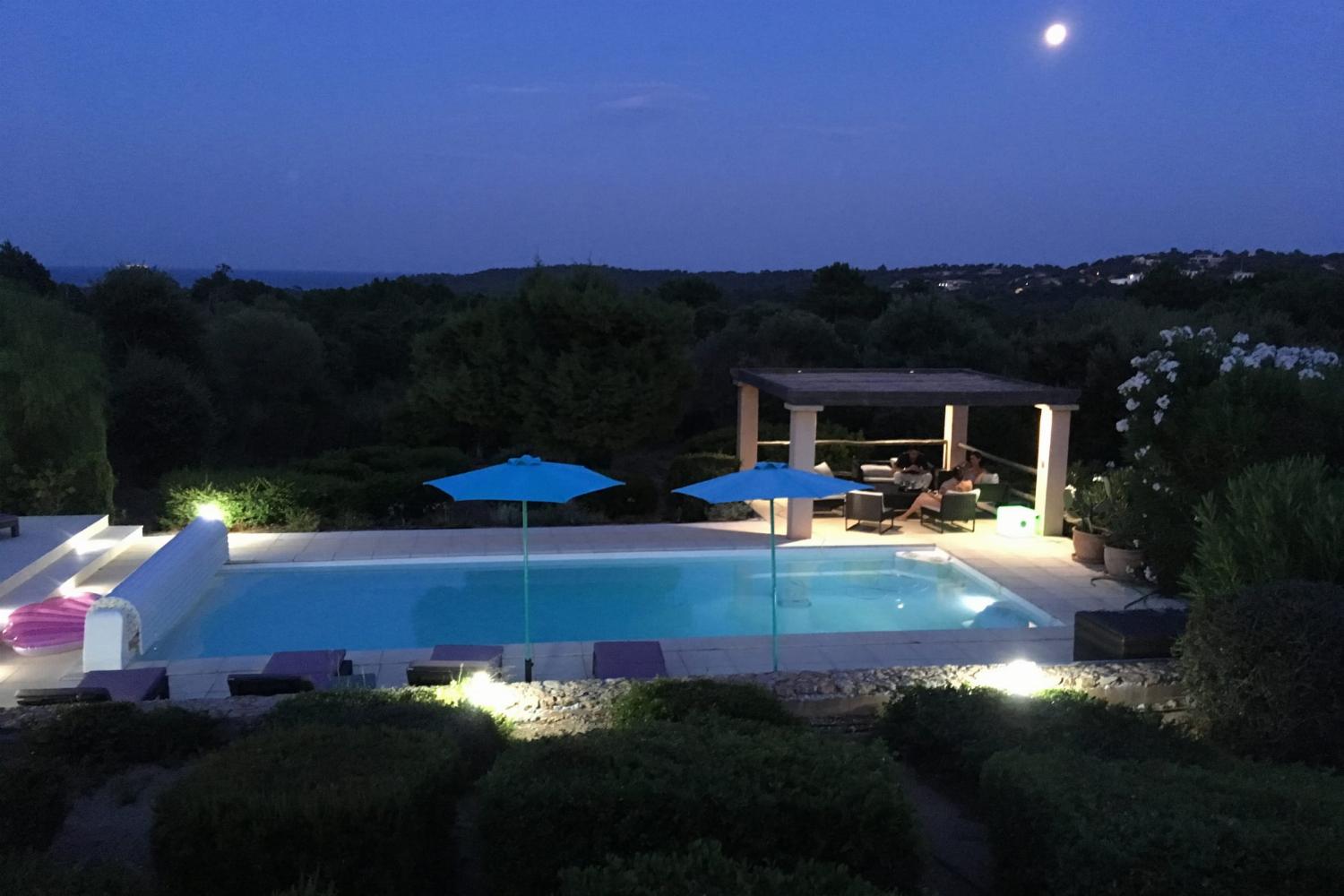 Private heated pool at night