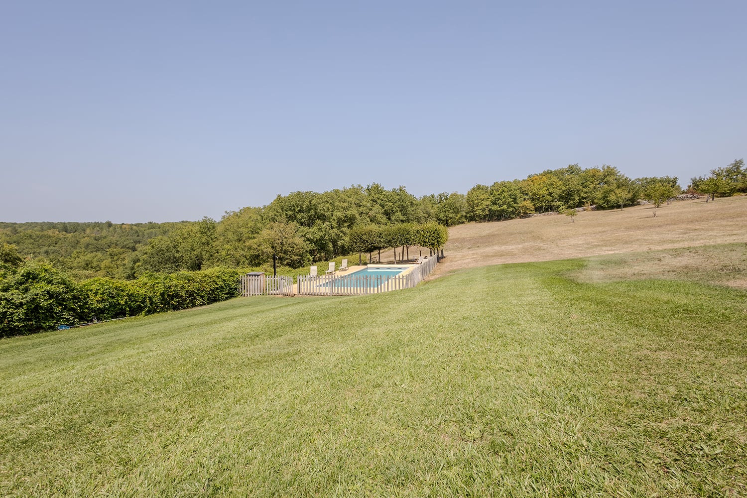 Lawned garden with private heated pool